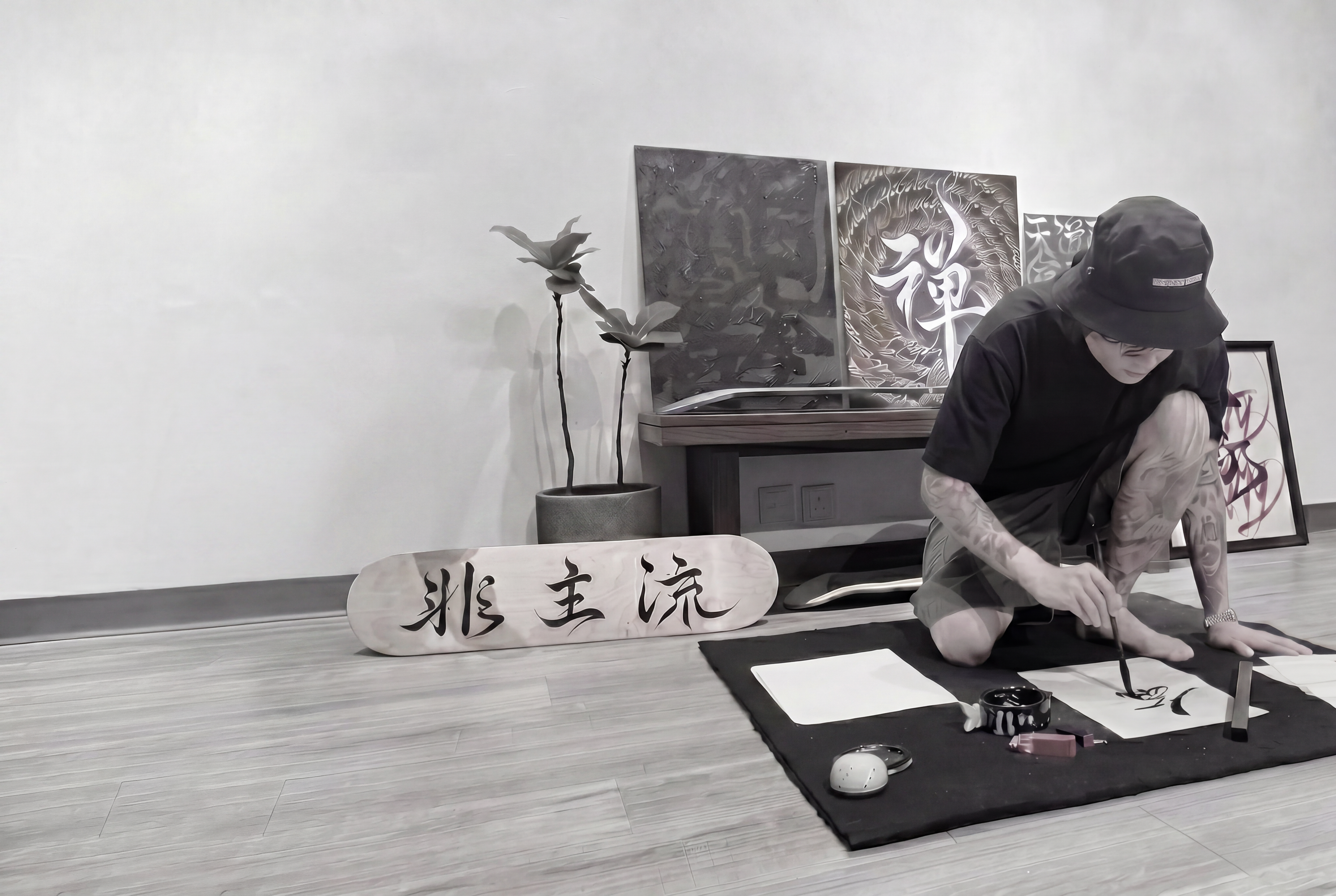 Person practicing calligraphy in a room with artistic decor