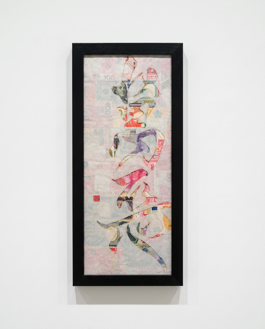 Framed abstract artwork with colorful geometric design on a white wall